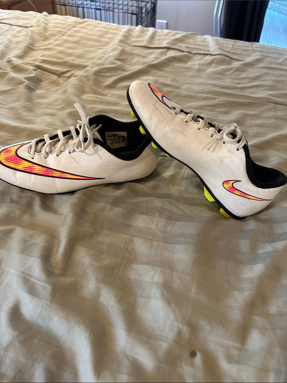 Nike Kids White Soccer Cleats with Neon Yellow and Pink Swoosh
